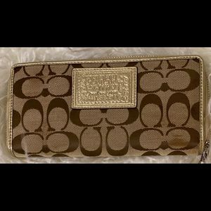 Coach Daisy gold logo zip wallet, purple interior